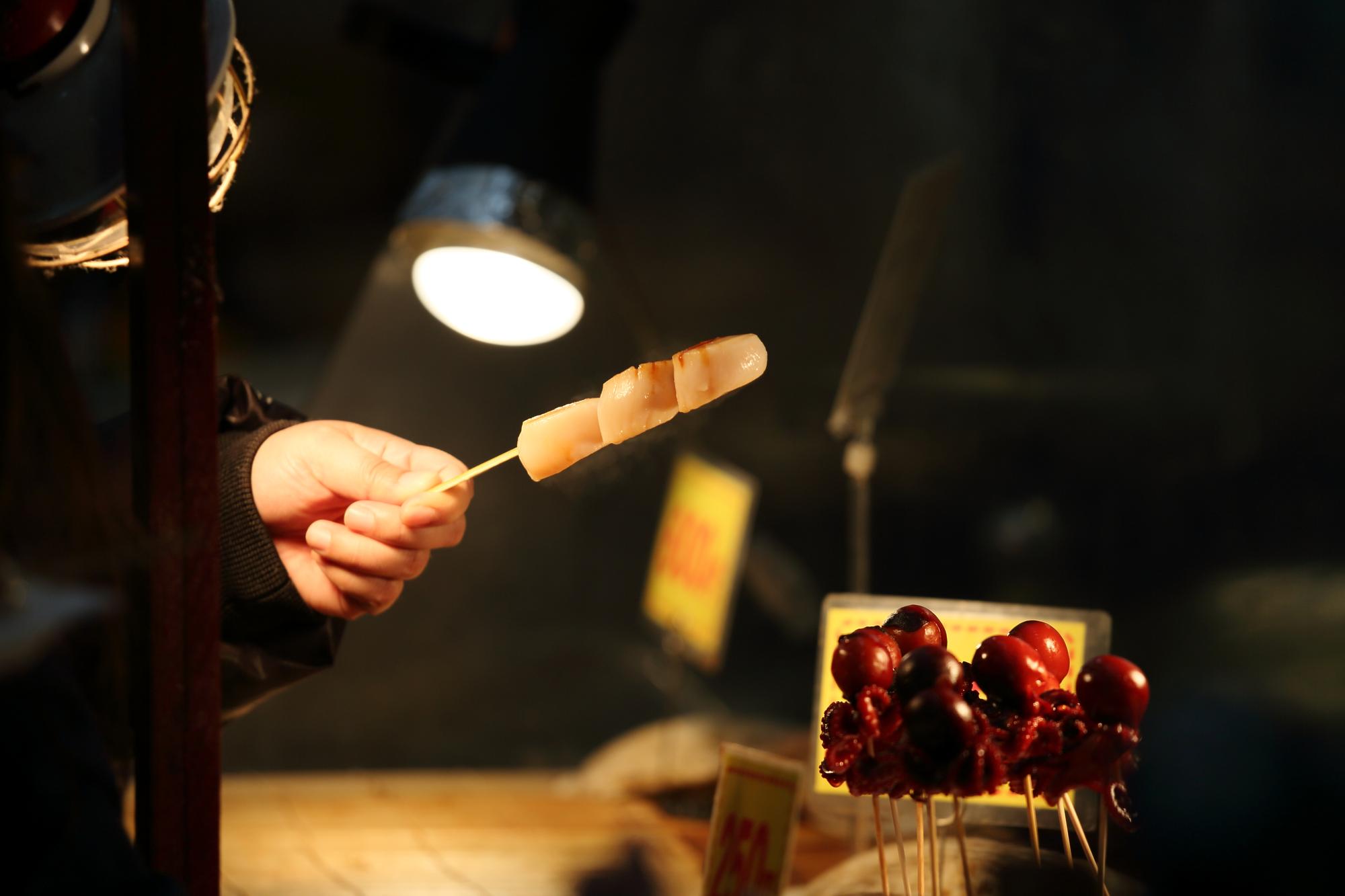 Chef torching a dessert at a private event
