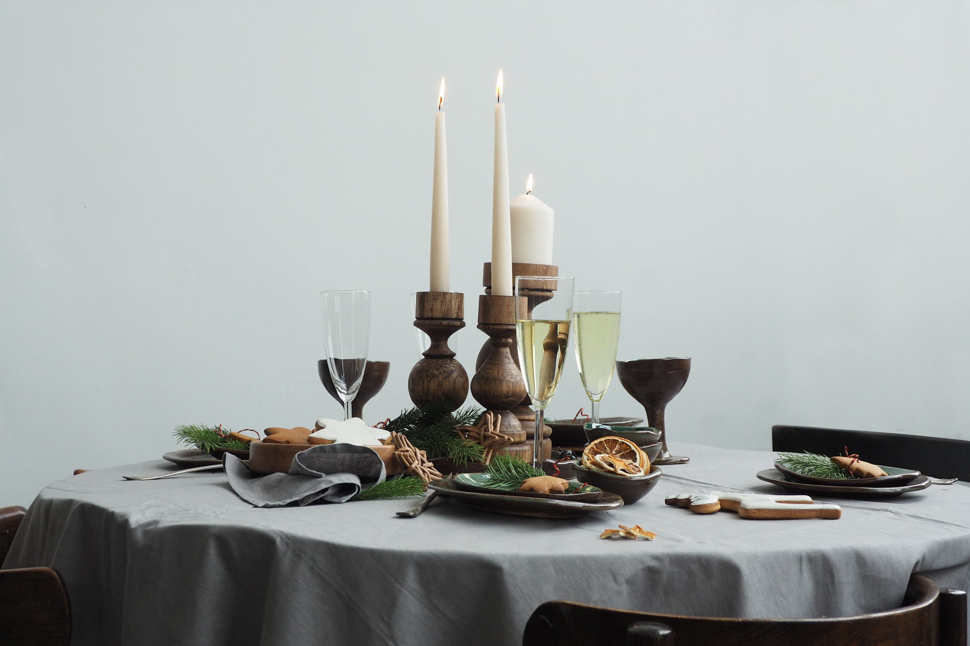 Intimate dining table set with candles and plates