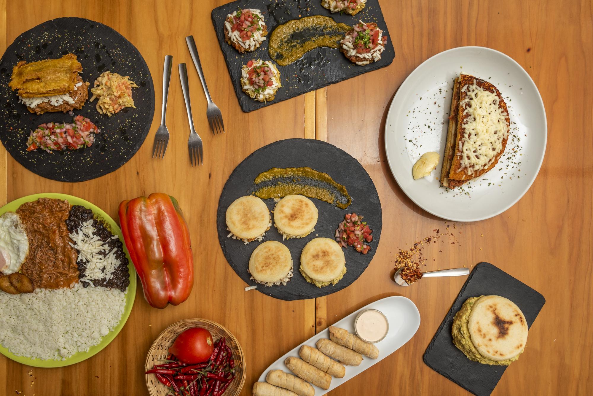 Assorted plated dishes on a wooden table